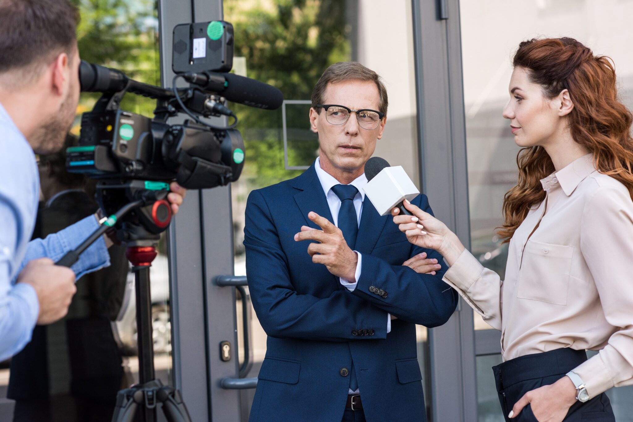 businessman cameraman-and-news-reporter-talking-